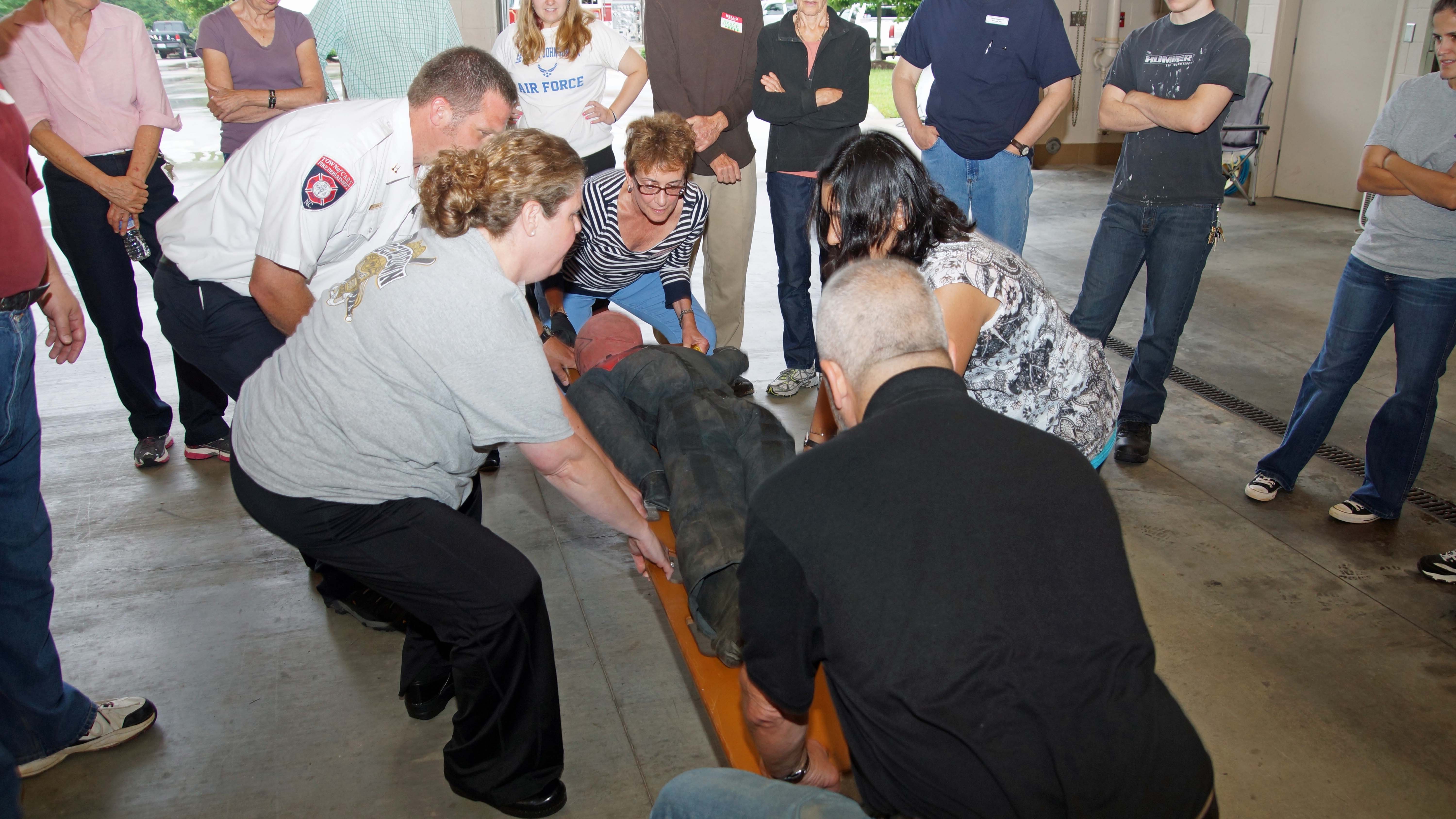 photo of CERT class practising carrying an injured person